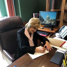 Senator Hyde-Smith signs her 'Gold Star Families' resolution for introduction.