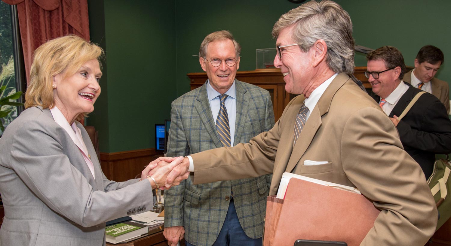 Senator Hyde-Smith greets Delta Council representatives Chip Morgan, Frank Howell and Woods Eastland