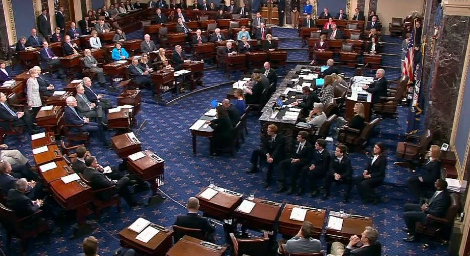 Senator Hyde-Smith, on left, stands to cast her vote to confirm Brett Kavanaugh to the U.S. Supreme Court