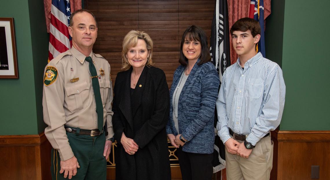 Senator Hyde-Smith visits with Clay County Sheriff Eddie Scott, his wife Lorie, and son Bradley