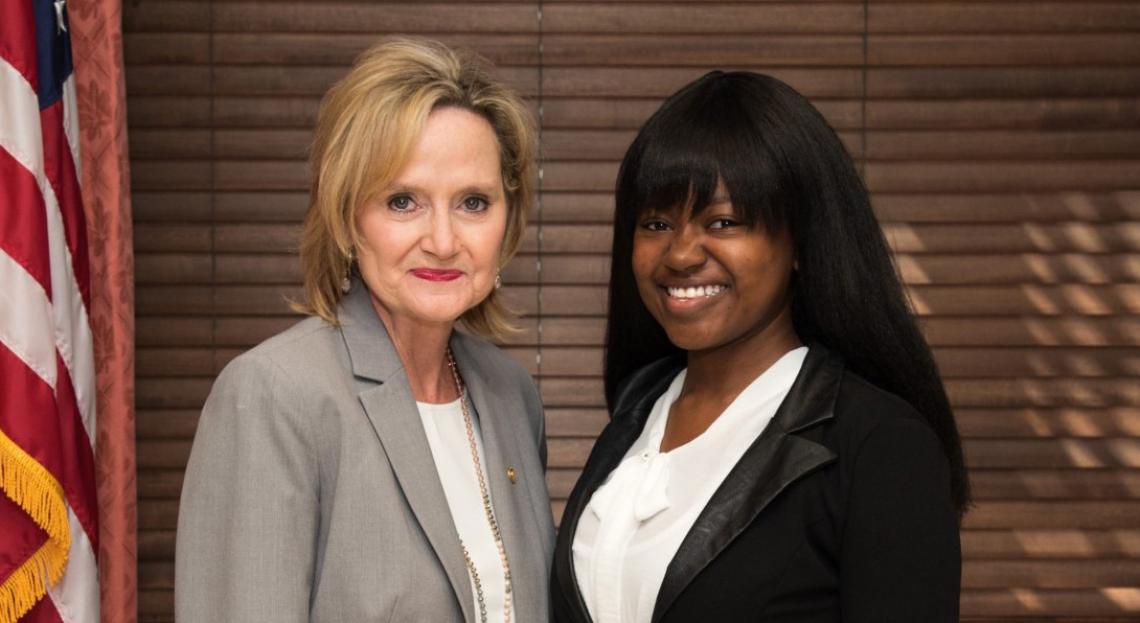 Senator Hyde-Smith visits with Jasmine King of Vicksburg, an intern with USDA APHIS