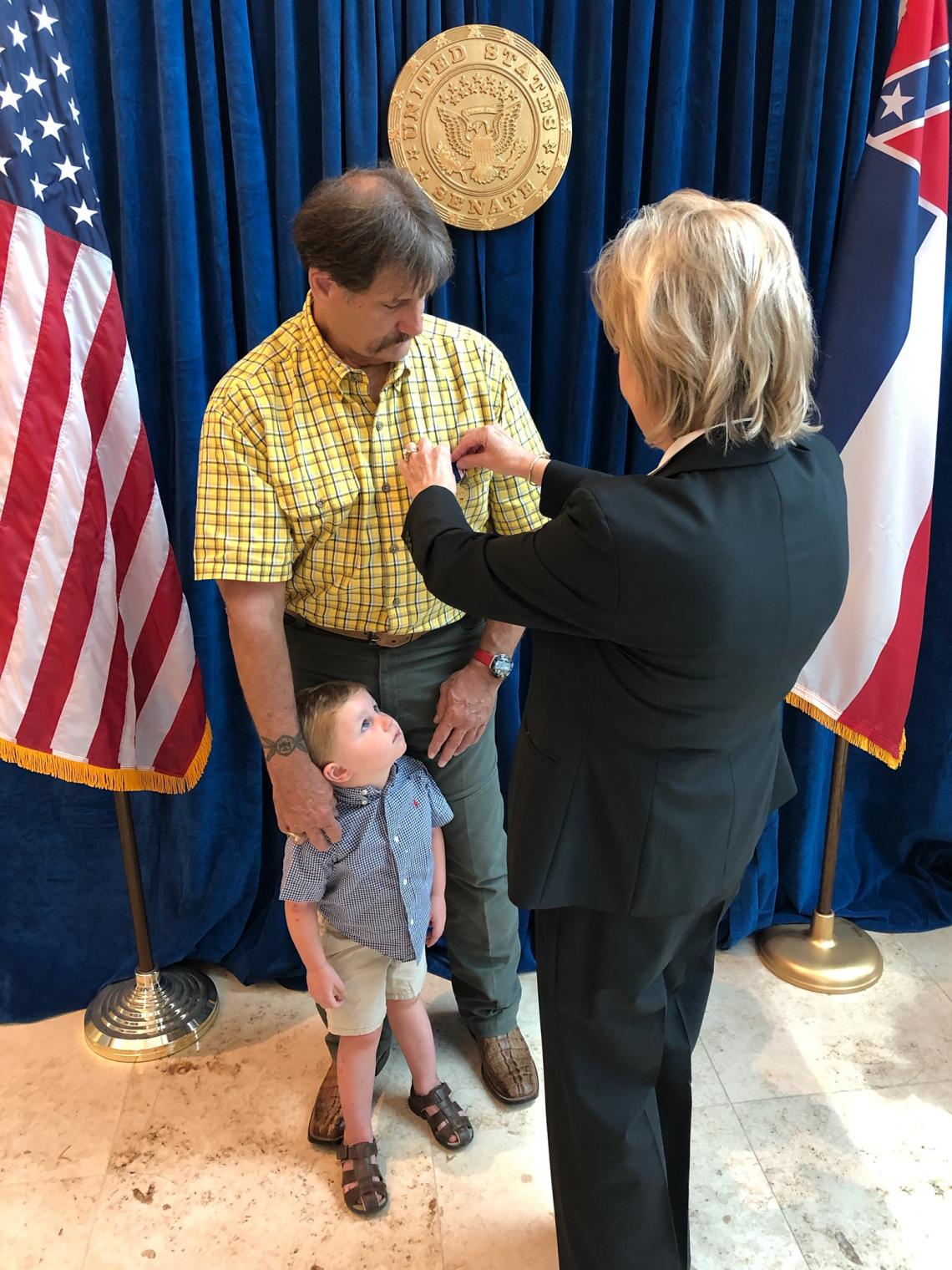 Senator Hyde-Smith presents John “Jay” Fulton Blount of Greenville with the Secretary of Defense Medal for the Defense of Freedom. (Aug. 20, 2019)