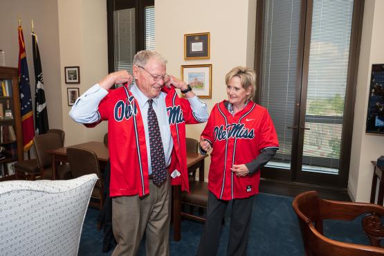 Senators Hyde-Smith and Jim Inhofe (R-Okla.) settle a wager after the Ole Miss baseball team beat Oklahoma to win the College World Series. (July 20, 2022)